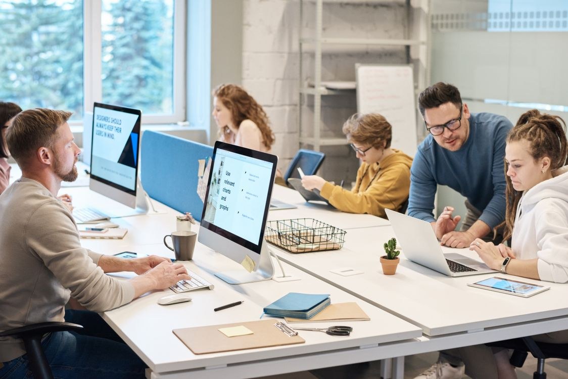 Corporate team working on computers in a modern office